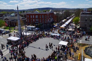 BloomsburgPA overhead view of Renaissance Jamboree with performers in center area, crowds & tents along street