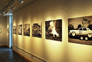 Five photographs on wall of Christine Pearl exhibit