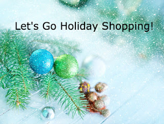Lets go holiday shopping - festive display of holiday blue and green ornaments lay with pine needle branch and snow