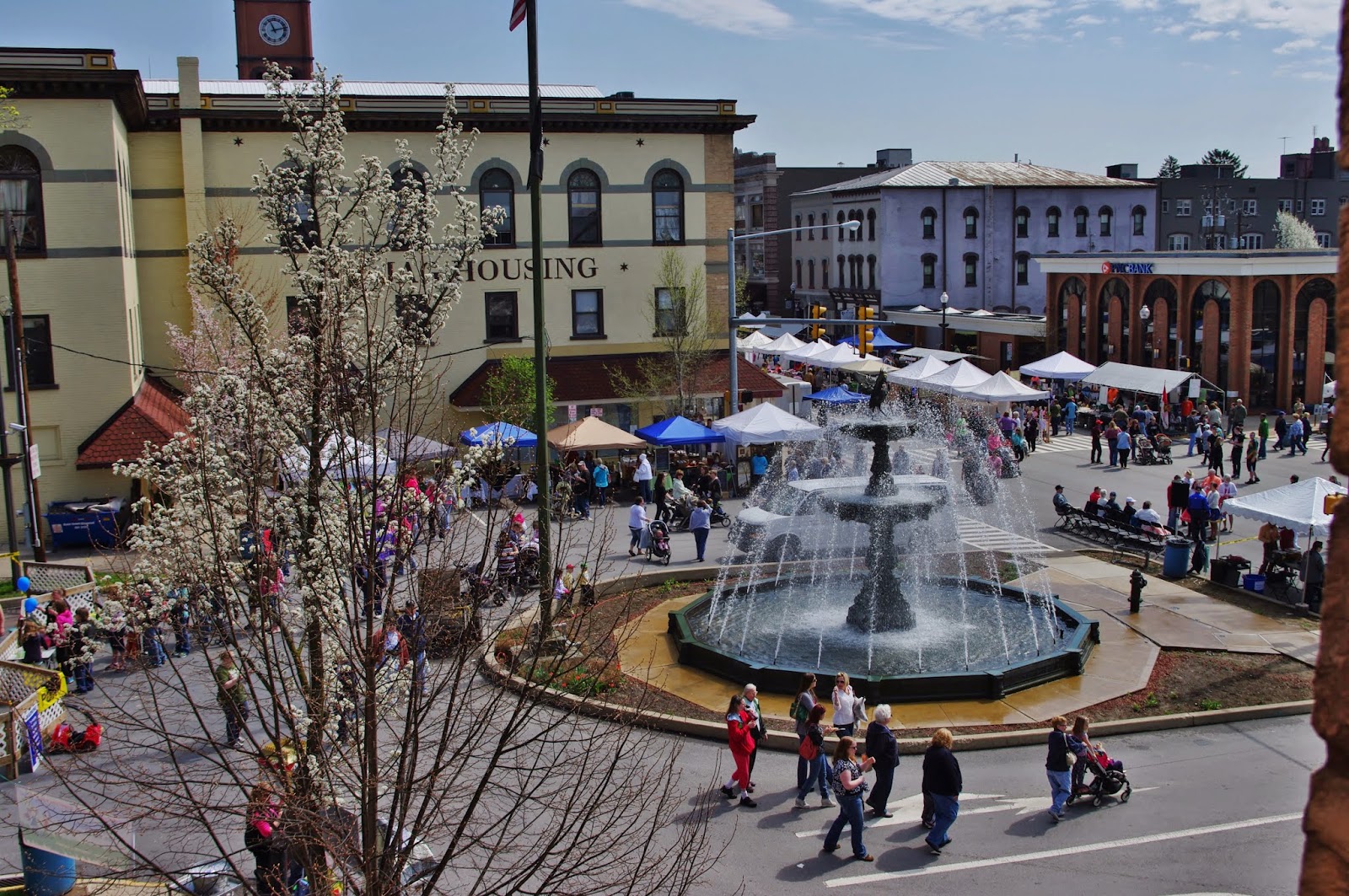 birds eye view of fountain gushing water on Center Street of Bloomsburg during the renaissance jamboree as people gather in the streets to enjoy