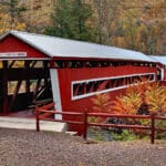 East & West Paden Covered Bridges - two red bridges with white trim end to end over stream