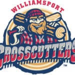 Williamsport Crosscutters logo: Bearded woodsman with red checked cap and shirt, log on one shoulder, bat on other