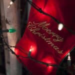 Red Christmas Stocking with 'Merry Christmas' embroidery & Christmas lights in front