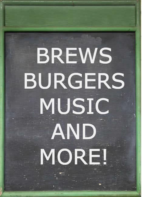 Green framed chalkboard with white text: Brews Burgers Music and More!