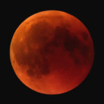 Red glow of Blood moon seen from Earth during lunar eclipse
