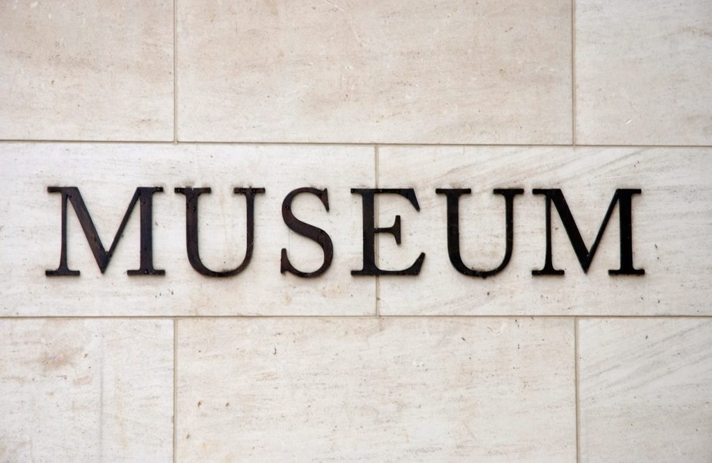 closeup of 8 limestone rectangular stones with black text: Museum