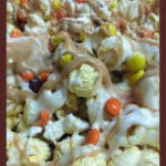 closeup of popcorn with milk & white chocolate drizzles and M&Ms