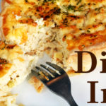 closeup of part of upside down fork and quiche on white plate Text: "Dig In!"