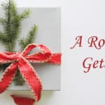 white gift box with red ribbon bow and pine sprigs text: A Romantic Getaway