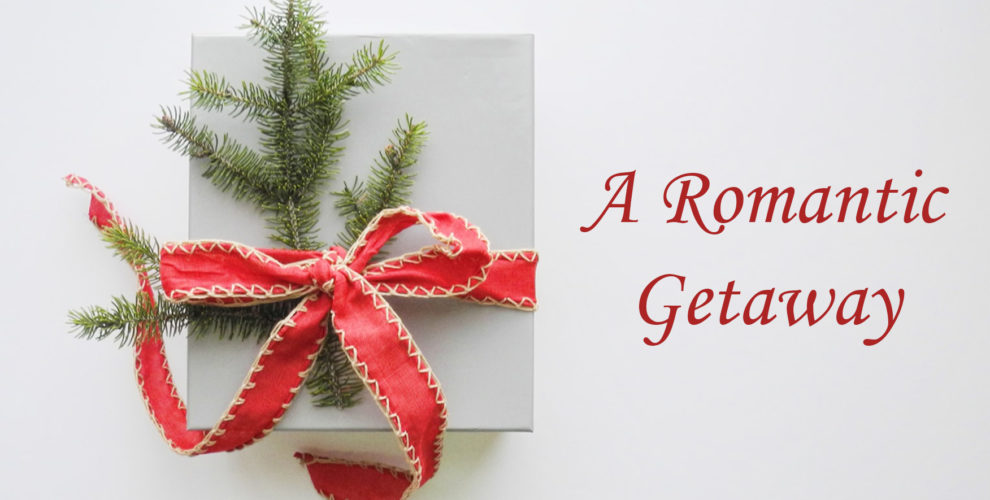 white gift box with red ribbon bow and pine sprigs text: A Romantic Getaway