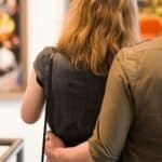 Couple looking at artwork in a gallery