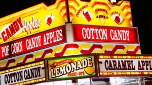 Lit up carnival food vendor signage