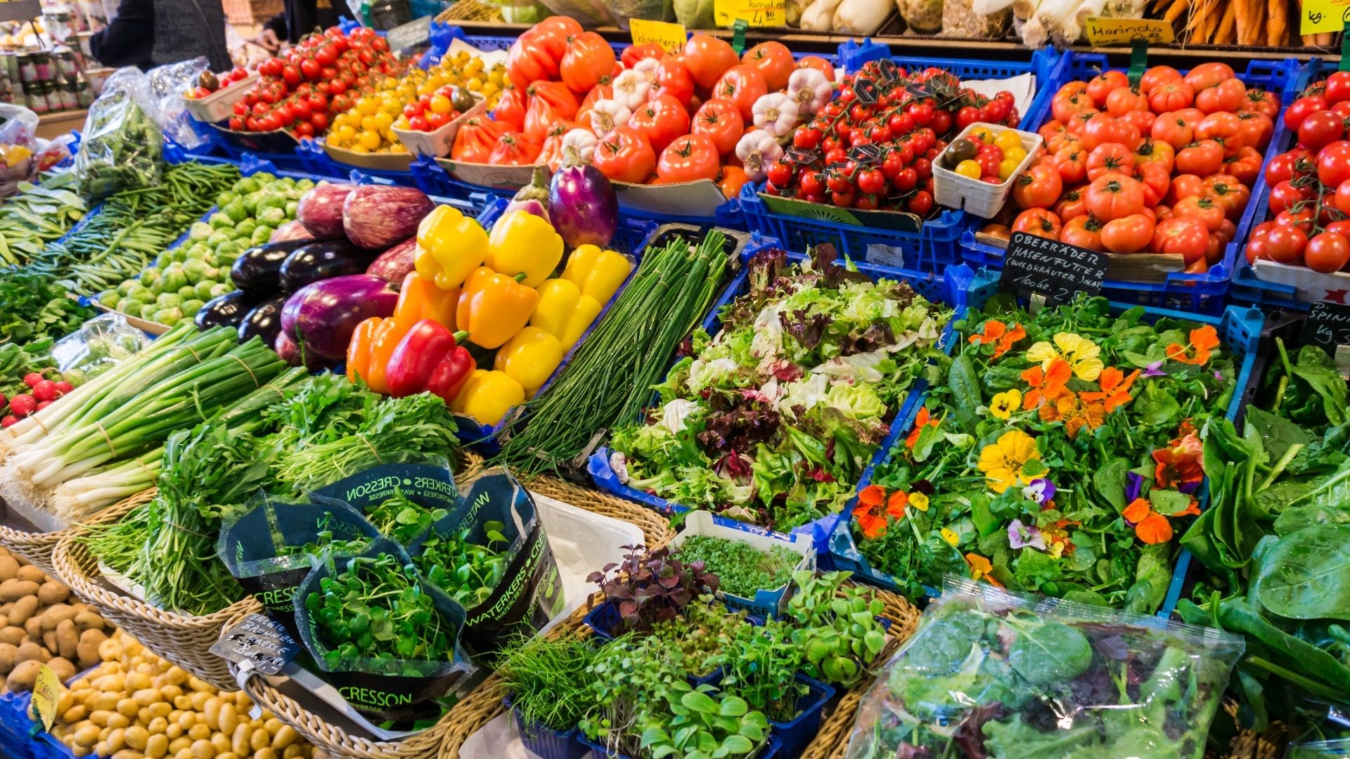 vibrant vegetables in crates on display at a farmers market
