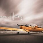 Artistic photo of a vintage yellow plane with text “Pennsylvania History”