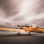 Artistic photo of a vintage yellow plane with text “Pennsylvania History”